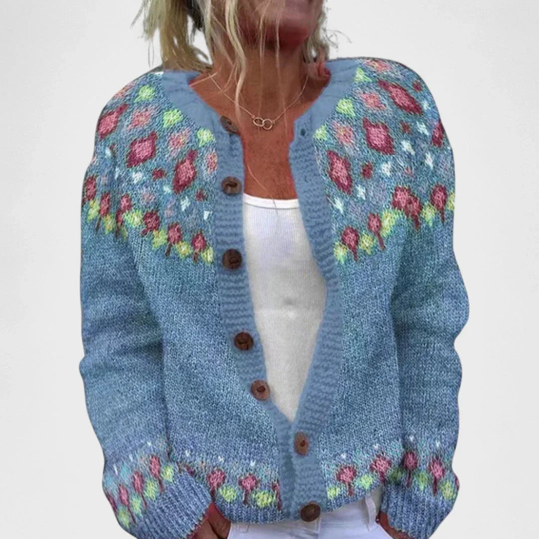Powder blue knit cardigan with multicolor stitched motifs and button front