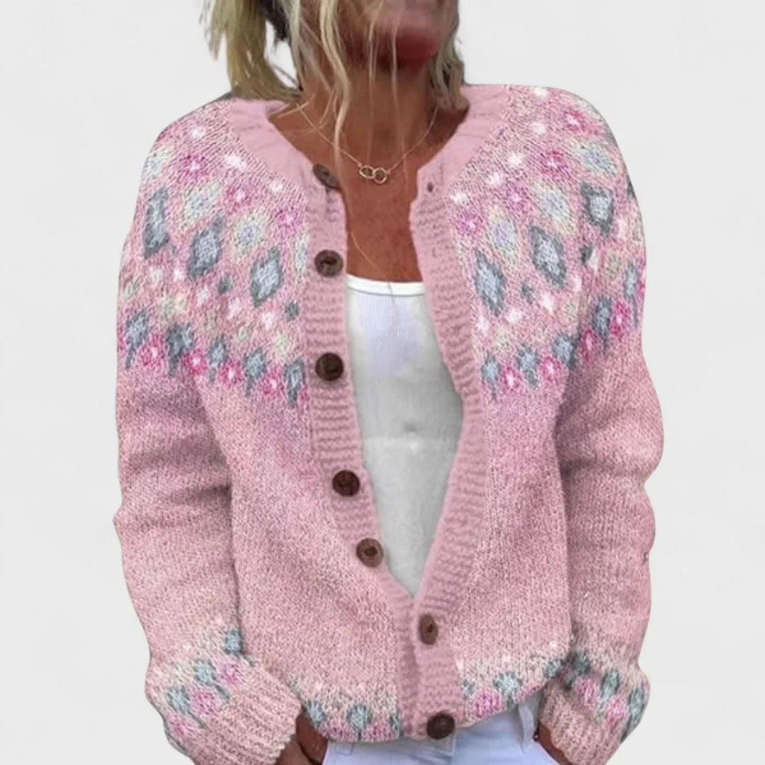 Petal pink knit cardigan with multicolor stitched motifs and button front