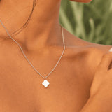 Silver V-chain pendant necklace with white clover charm