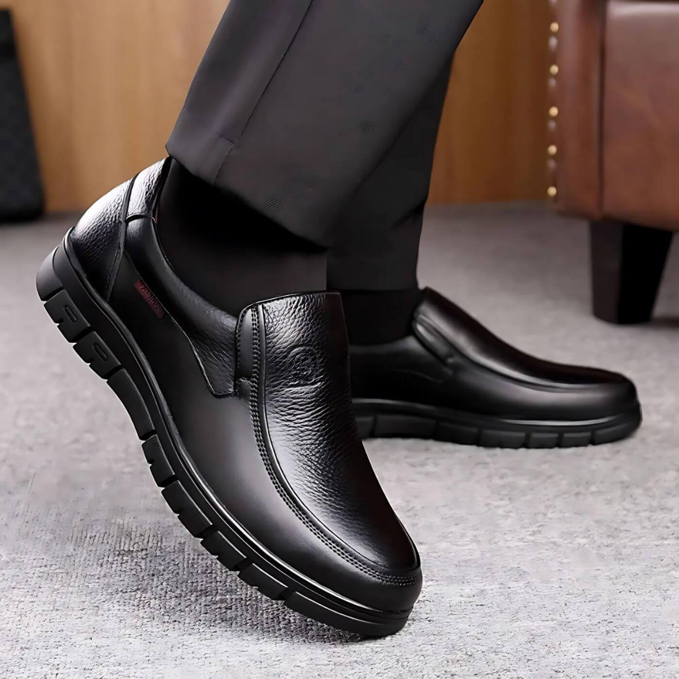 Black slip-on shoes with padded collar and sculpted non-slip outsole