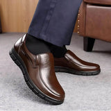 Brown leather slip-on non-slip shoes with cushioned collar and chunky tread sole