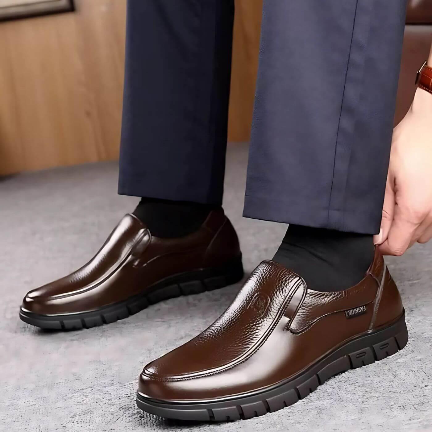 Brown slip-on shoes with stitched upper and dark rubber non-slip outsole
