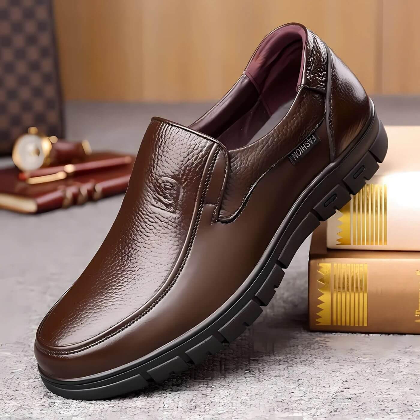 Brown leather slip-on shoes with dark lining and chunky non-slip tread outsole