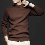 Brown high-neck knit sweater with long sleeves and ribbed hem.