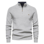 Men's off-white quarter-zip knit pullover with long sleeves, ribbed cuffs, and hem