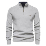 Men's off-white quarter-zip knit pullover with long sleeves, ribbed cuffs, and hem