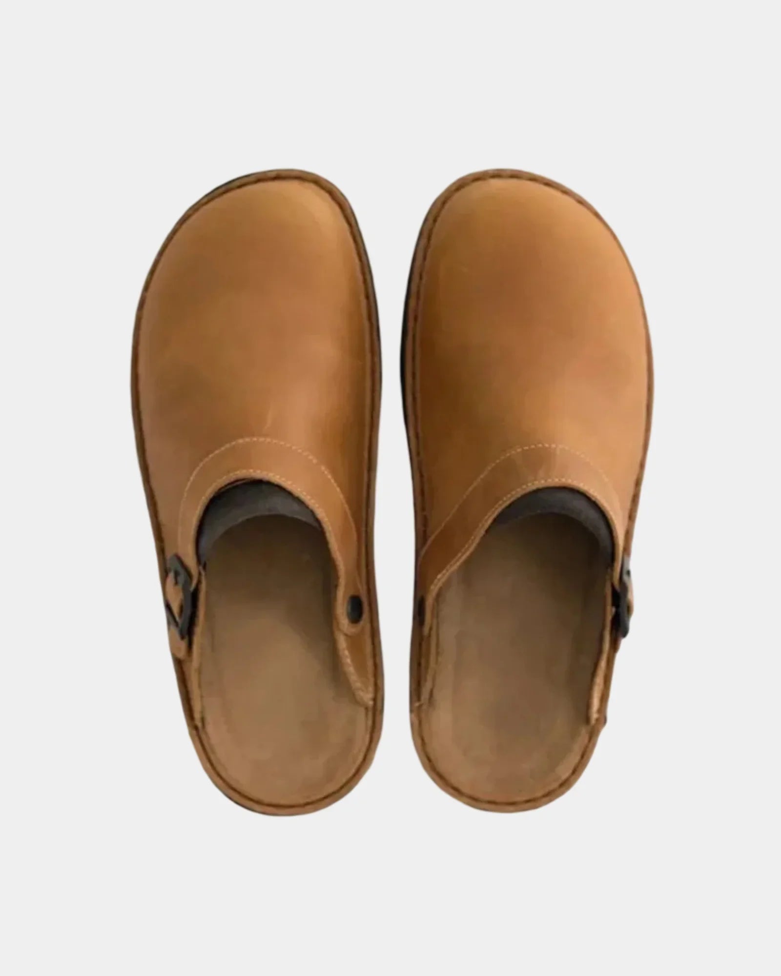 Tan suede clogs pair with adjustable buckle straps and rubber soles.