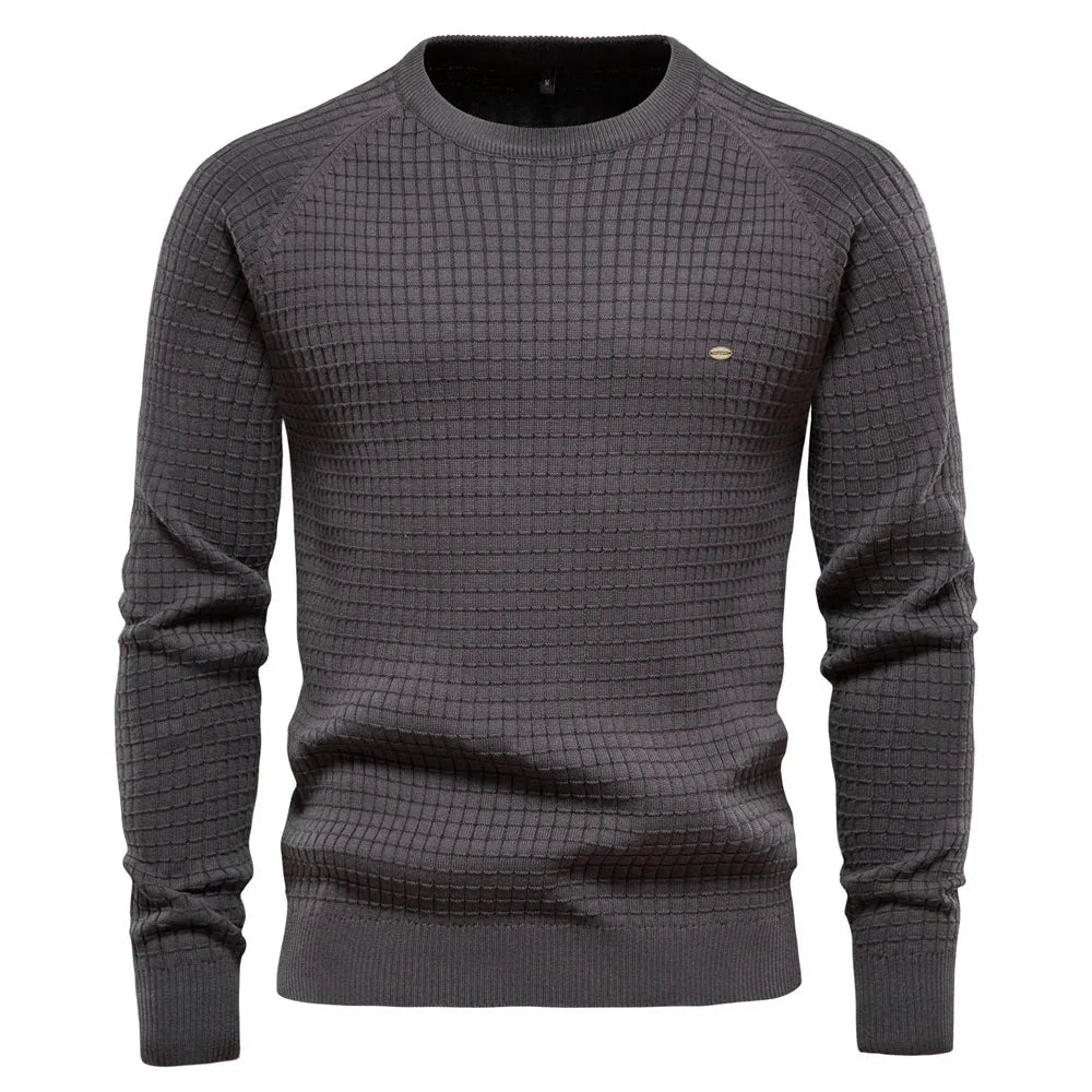 Men's dark gray knit pullover sweater with crew neck, ribbed cuffs and hem, small chest logo.
