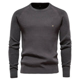 Men's dark gray knit pullover sweater with crew neck, ribbed cuffs and hem, small chest logo.