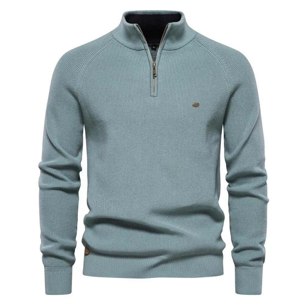 Men's teal quarter-zip knit pullover with long sleeves, ribbed cuffs, and hem