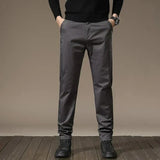 Charcoal gray slim chino pants with belt loops, button closure, straight tapered legs