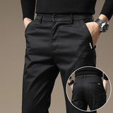 Charcoal gray slim chino pants with button fly, tapered legs, side and back pockets