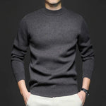 Charcoal gray high-neck knit sweater with long sleeves and ribbed hem.