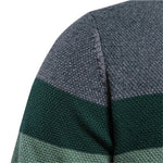 Knit sweater fabric close-up with gray, dark green, and light green stripes