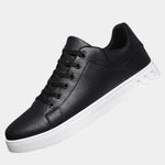 Black orthopedic lace-up shoe with padded collar and white rubber sole