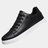 Black orthopedic lace-up shoe with padded collar and white rubber sole