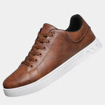 Brown orthopedic lace-up shoe with padded collar and white rubber sole