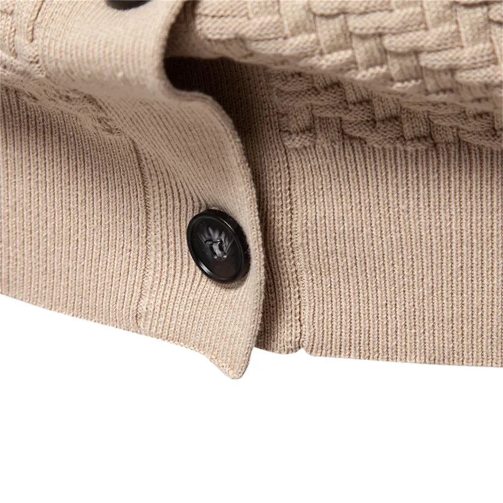 Beige knitted vest close-up of black button and ribbed cuff edge