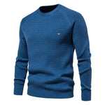 Men's blue knit pullover sweater with crew neck, ribbed cuffs and hem, small chest logo.