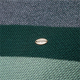 Brand logo patch on green band of a knit crewneck sweater