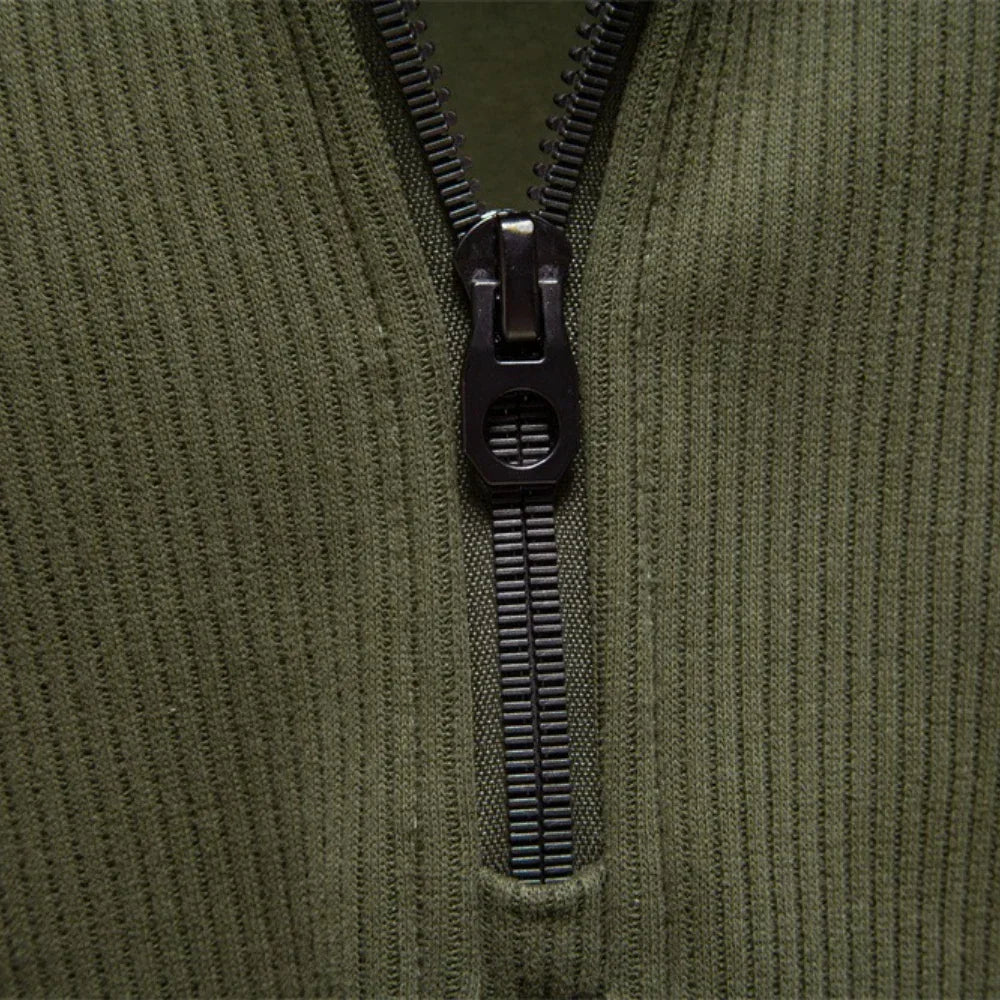 Men's olive green quarter-zip sweater zipper and placket close-up.