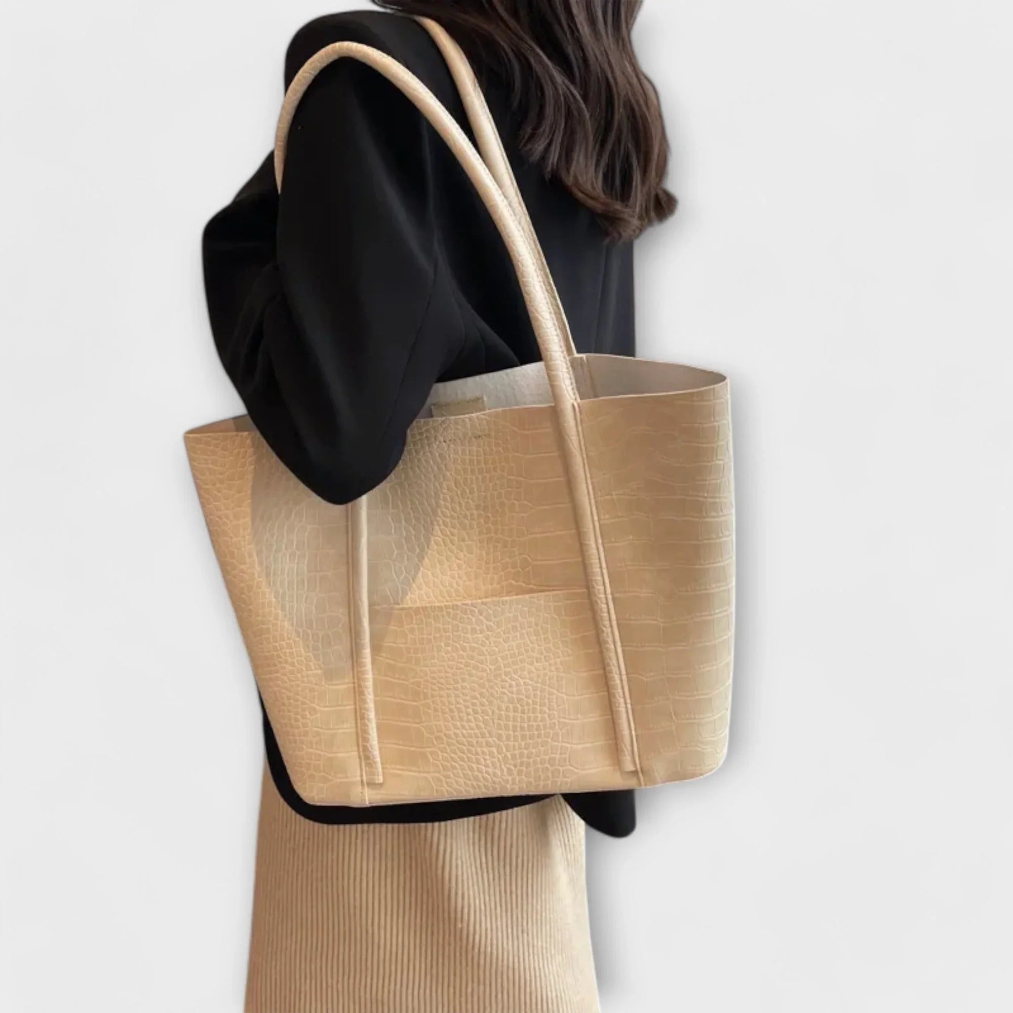 Light beige croc-embossed leather tote bag with wide handles and open top