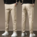 Sand color slim chino pants with button closure, belt loops, tapered legs