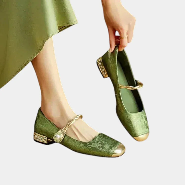 Green Mary Jane dance shoes with low heel, ankle strap, and decorative bow