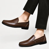 Brown leather loafers with stitched moc-toe and metal strap detail