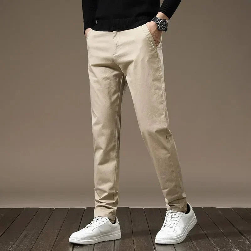 Sand color slim chino pants with button closure, belt loops, tapered legs