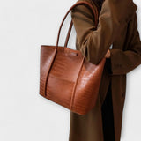 Cognac brown croc-embossed leather tote bag with double handles and open top