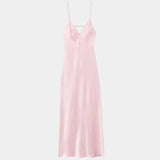 Pink satin slip dress with V neckline and spaghetti straps, straight floor-length hem