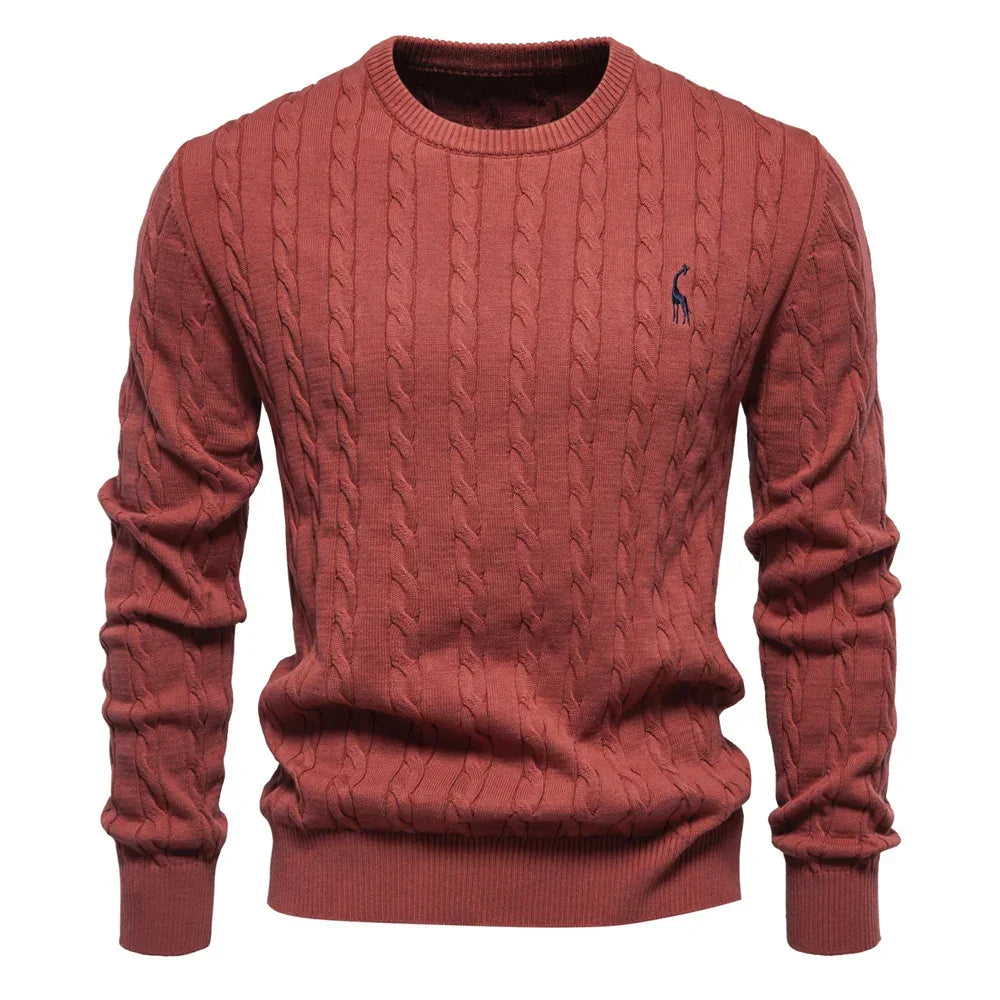 Men's red cable-knit crewneck sweater with long sleeves and small chest logo
