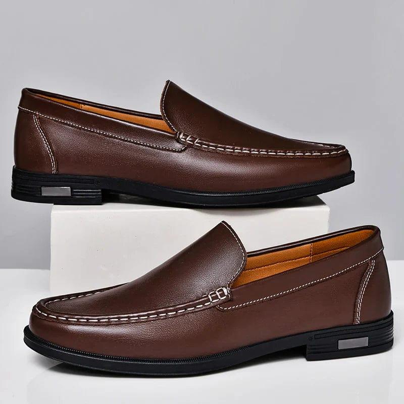 Pair of brown leather loafers slip-on with metal buckle strap and low block heel