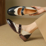 Two-tone leather Mary Jane shoes with buckle strap and textured toe detail