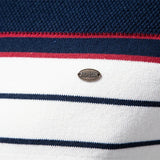 Striped knit sweater close-up with oval brand badge on white fabric, blue and red bands