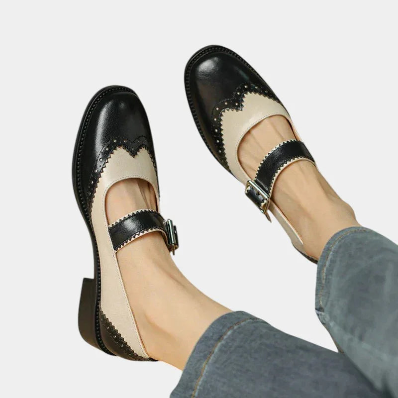 Two-tone leather Mary Jane shoes with buckle strap and wingtip detailing