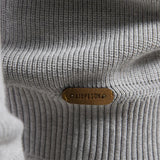 Men's light gray ribbed knit pullover with oval logo patch at hem