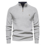 Men's light gray quarter-zip knit pullover with long sleeves, ribbed cuffs, and hem