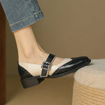 Two-tone leather Mary Jane flats with buckle strap and low block heel