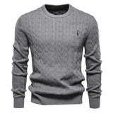 Men's dark gray cable-knit crewneck sweater with long sleeves and small chest logo