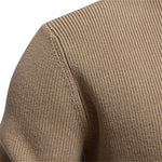 Khaki knit sweater close-up of shoulder seam and textured knit pattern