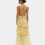 Yellow floral tiered maxi dress with crisscross open back and thin straps