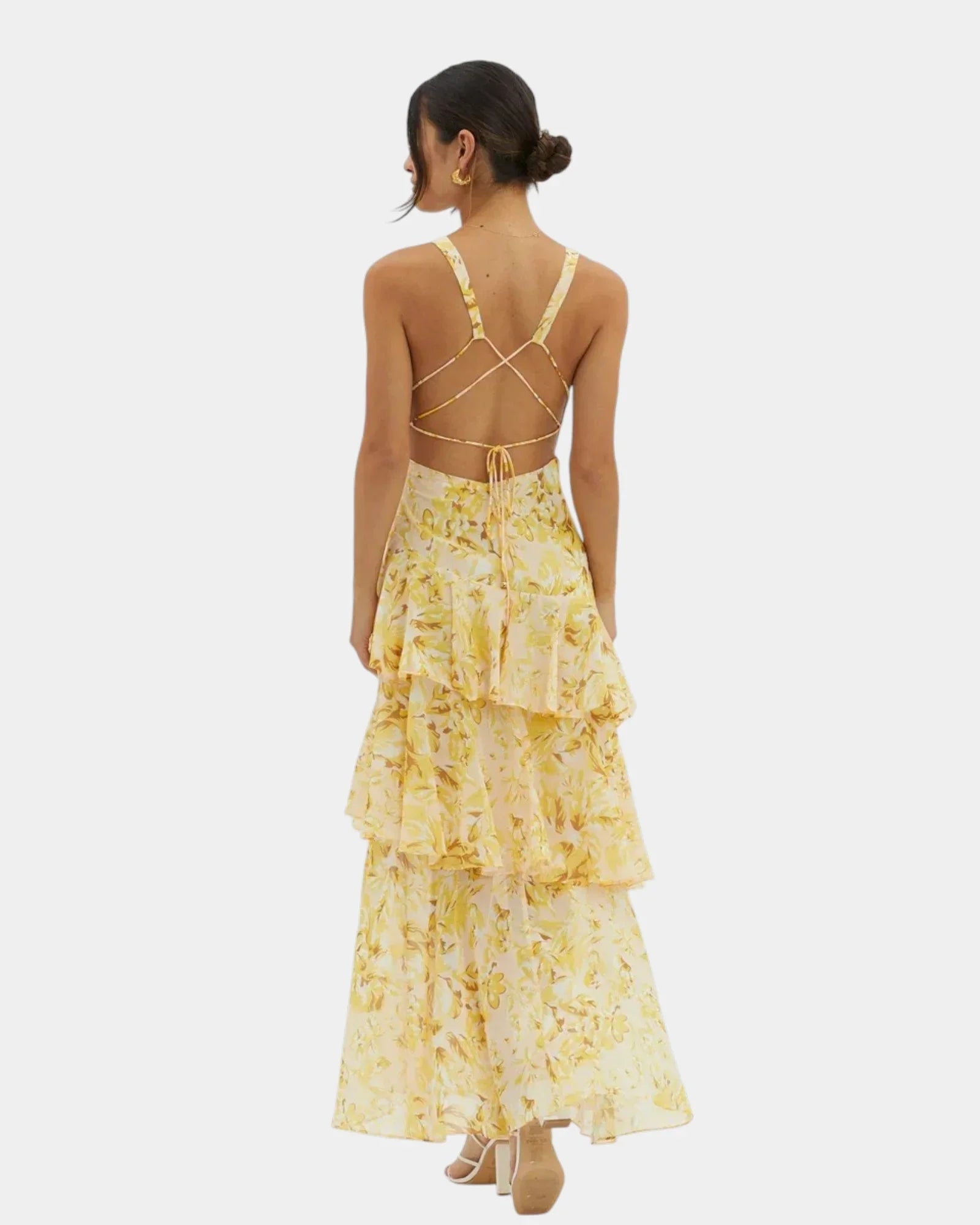 Yellow floral tiered maxi dress with crisscross open back and thin straps