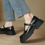 Black T-bar platform shoes with gold buckle and rubber tread sole