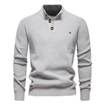 Men's knit sweater in light gray with henley-style button placket and long sleeves