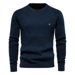 Men's navy blue knit pullover sweater with crew neck, ribbed cuffs and hem, small chest logo.