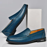 Men's blue leather loafer shoes with metal buckle detail and stitched edging
