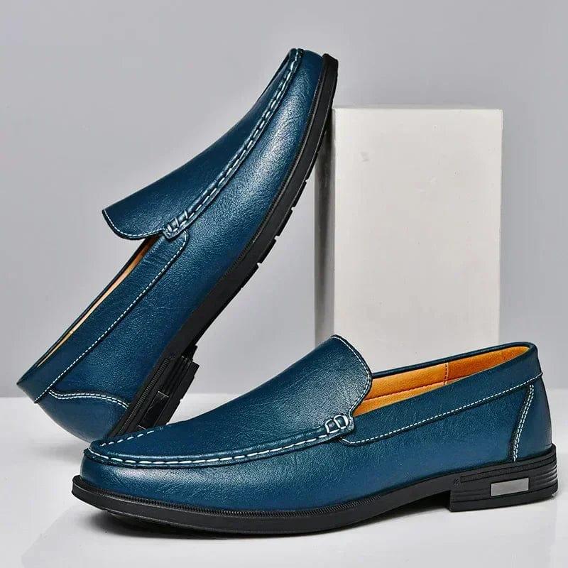 Men's blue leather loafer shoes with metal buckle detail and stitched edging