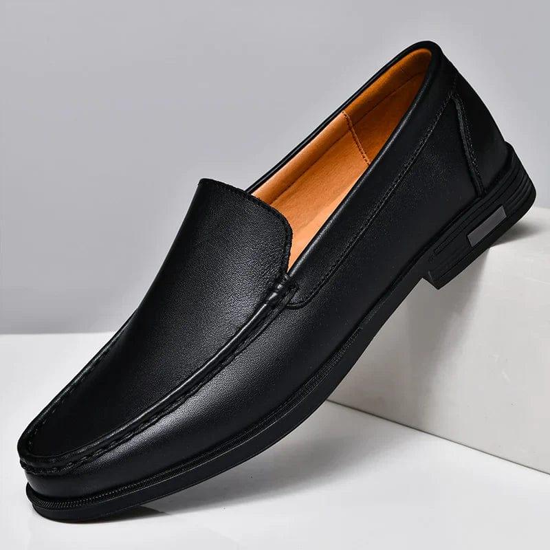 Black leather loafer slip-on with side seam details and low block heel